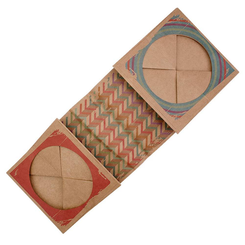 Kraft paper cat tunnel folded flat, showing the zigzag print and two round openings