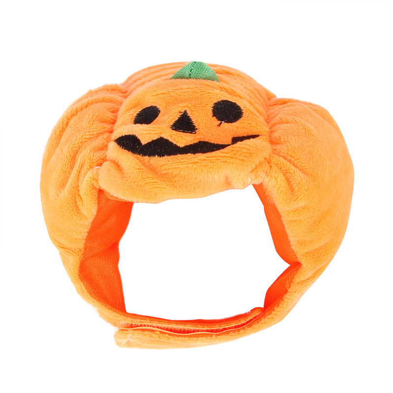Makuro's Pumpkin Hat: plush orange jack-o'-lantern cat hat with a green stem