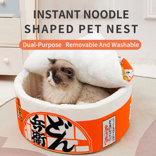Fluffy cat napping inside the orange instant noodle cat bed with the lid half open