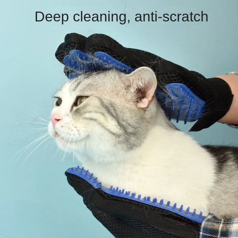Person grooming a cat wearing two silicone grooming gloves