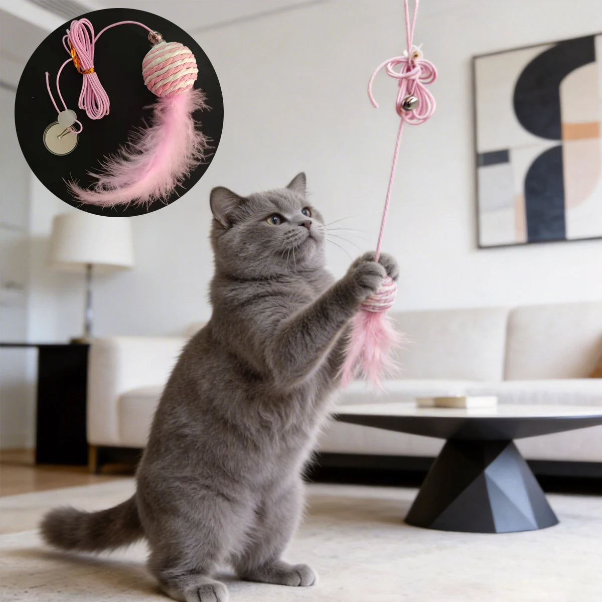 Grey cat playing with the pink sisal ball refill