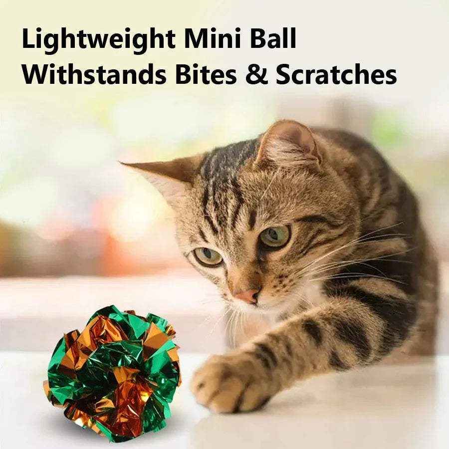 Tabby cat reaching for a colourful mylar crinkle ball