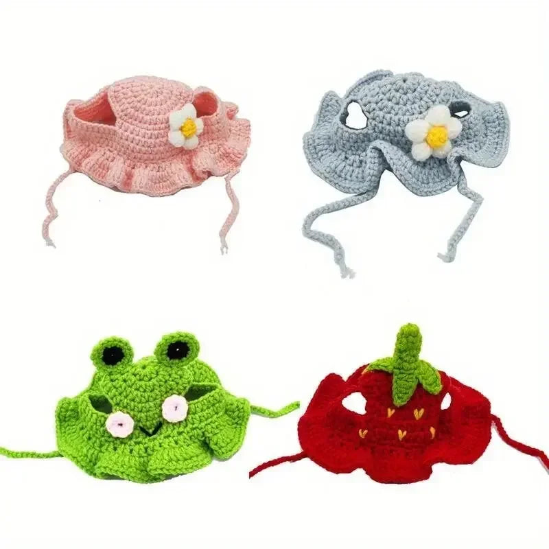 All four crochet bonnets: pink daisy, blue daisy, frog and strawberry