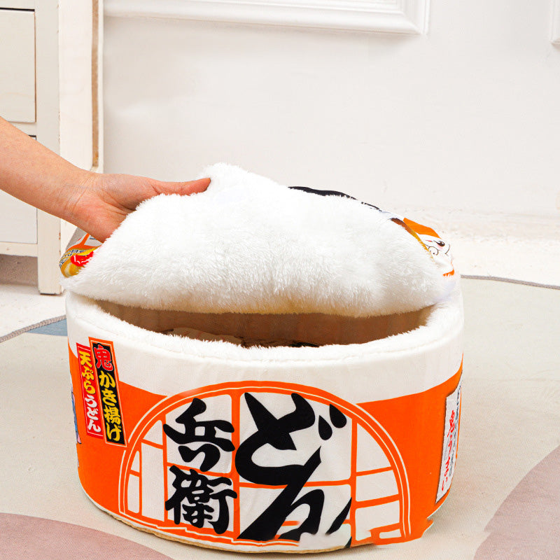 Lifting the fluffy lid on the orange instant noodle cat bed, a nap pod Miso would love
