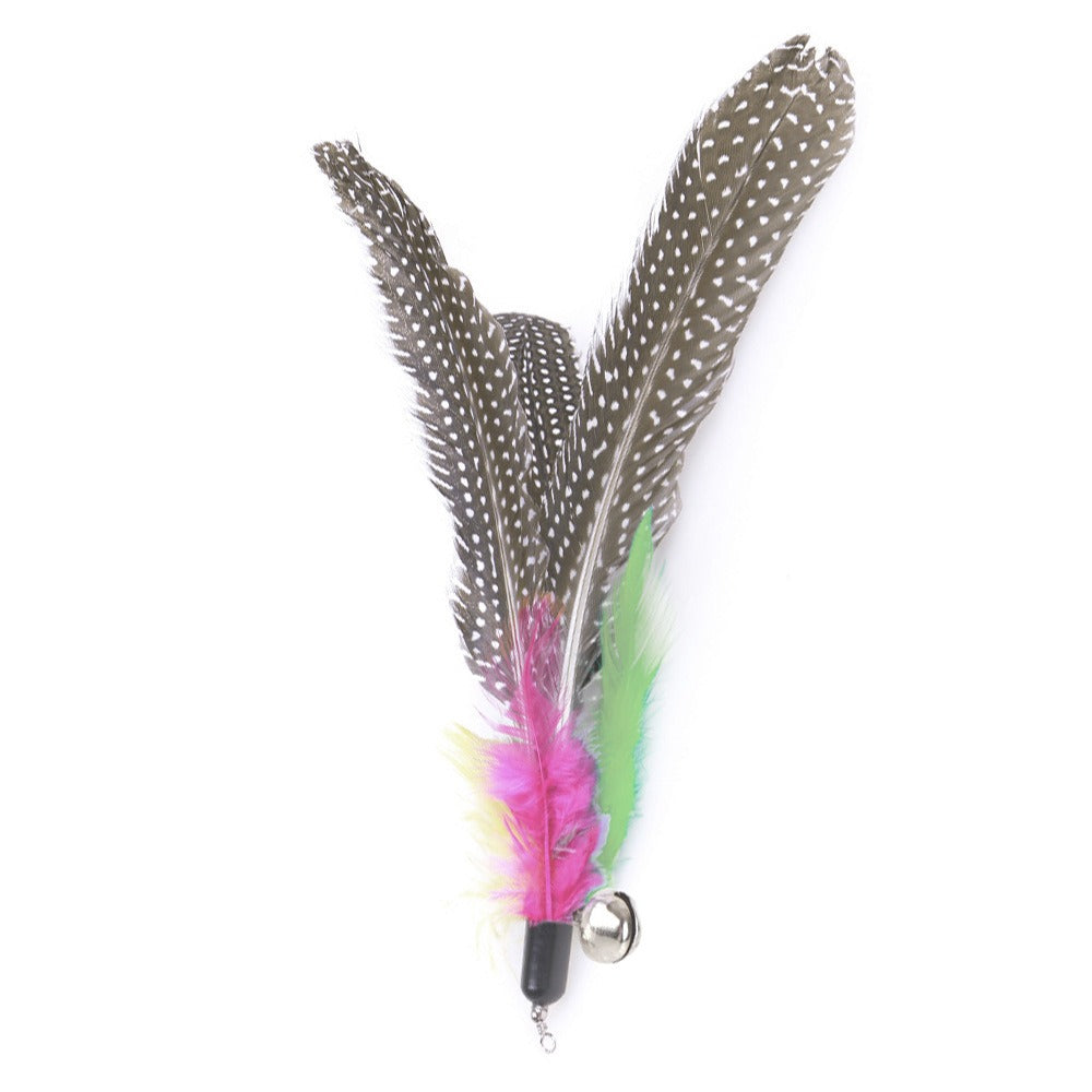 Speckled feather wand cat toy head with a bell, a spare for when Mugi wins