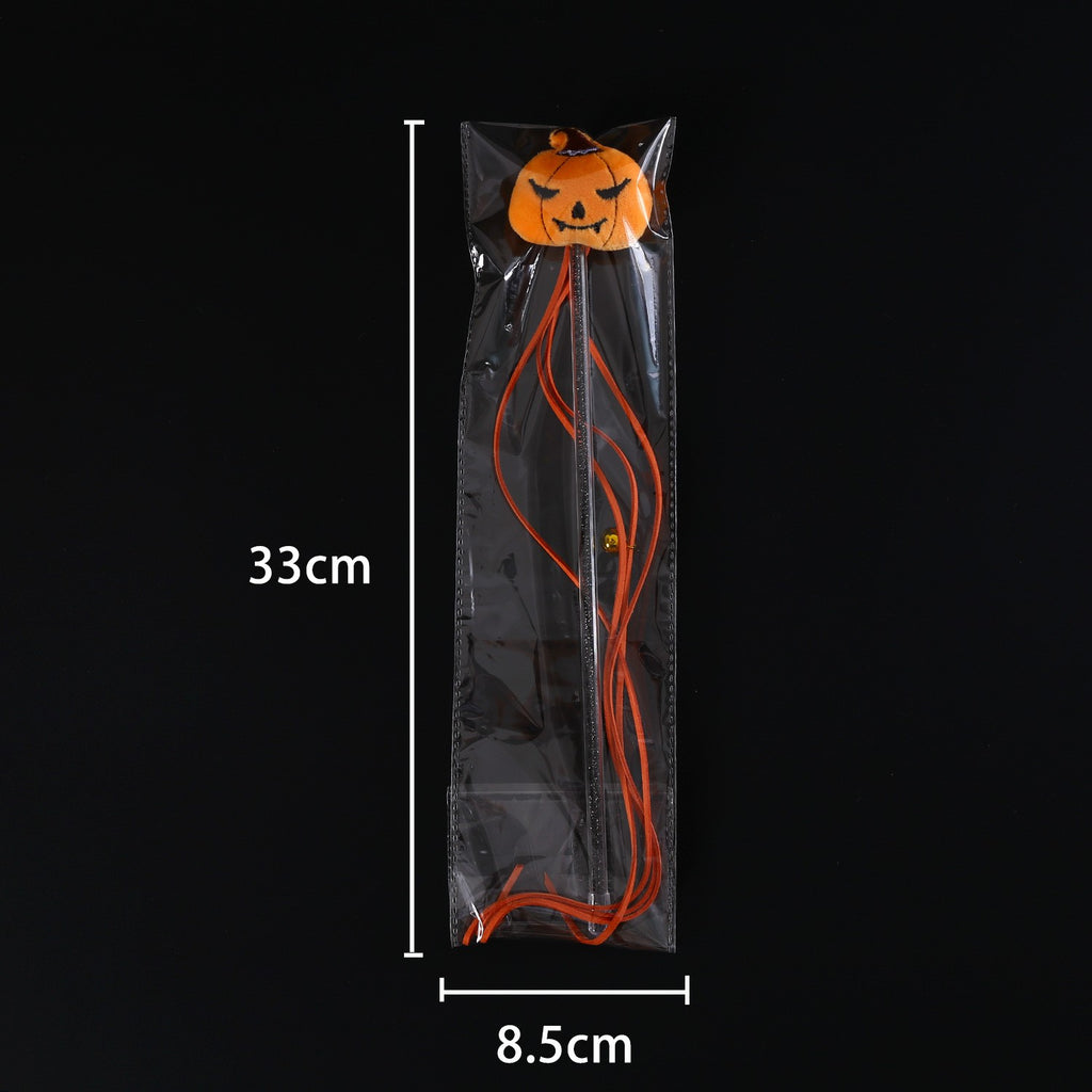 Pumpkin teaser wand in its clear bag, 33 x 8.5 cm
