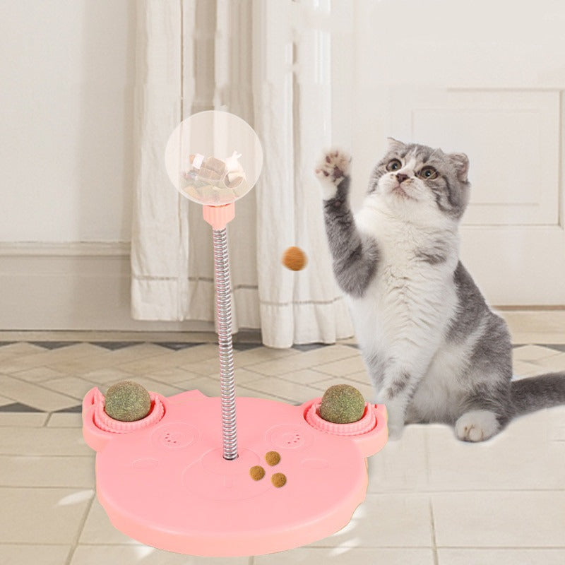 Pink wobble snack ball with a cat playing